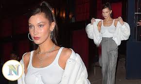 Bella Hadid leaves little to the imagination as she goes braless in sheer white top while dining out with Kendall Jenner and Hailey Baldwin in NYC