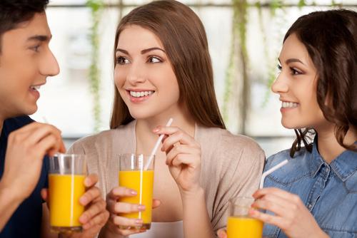 group-friends-drinking-orange-juice