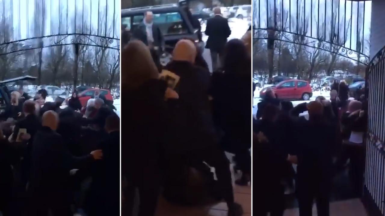 Punches fly as mass brawl breaks out between mourners at funeral, right next to the hearse