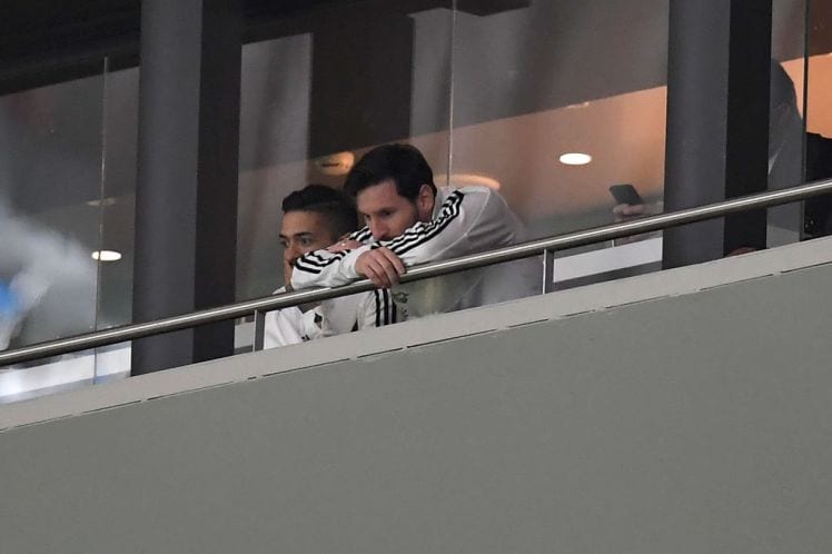 Argentina's forward Lionel Messi (R) reacts during a friendly football match between Spain and Argentina at the Wanda Metropolitano Stadium in Madrid on March 27, 2018. Messi was left out of Argentina's squad. He had been feeling pain in his hamstring and despite coach Jorge Sampaoli insisting the striker was fit, he did not even make the bench at the Wanda Metropolitano in Madrid. / AFP PHOTO / GABRIEL BOUYS (Photo credit should read GABRIEL BOUYS/AFP/Getty Images)