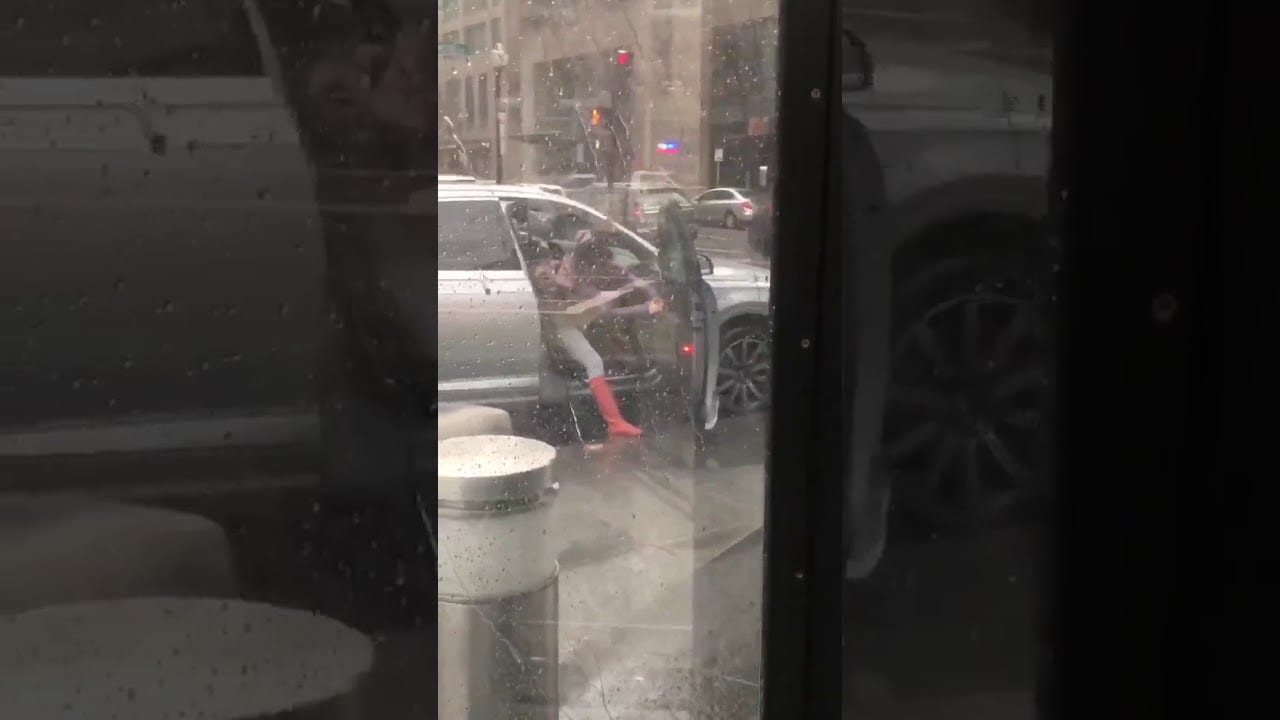 Woman can't close car door because of high winds