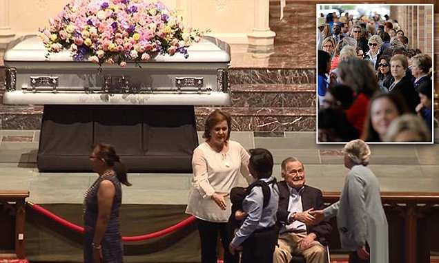 Together until the end: Heartbroken George H. W. Bush surprises mourners by sitting next to Barbara's coffin to greet the thousands who lined up to pay their respects to the former First Lady