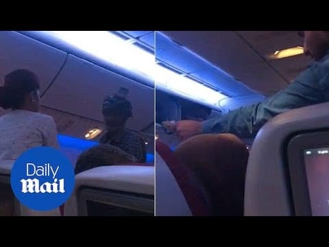 Moment man holds up commercial flight by begging passengers - Daily Mail