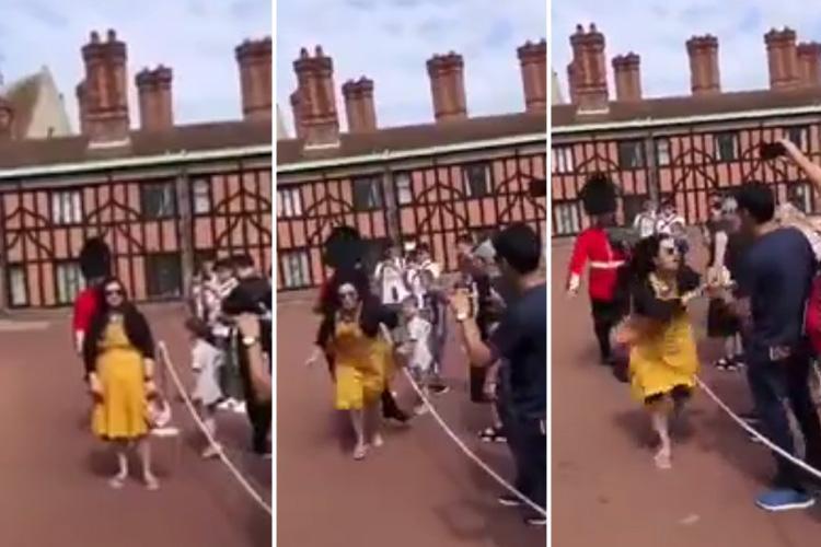 Guardsman SHOVES tourist after she stood in his way during drills outside Windsor Castle