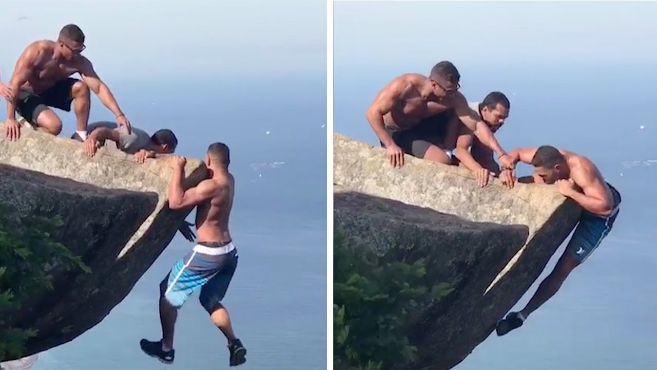 Daredevils Help Man Hanging From Rock