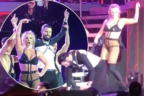 Britney Spears walks Rylan Clark-Neal on a LEAD and dances with him on stage