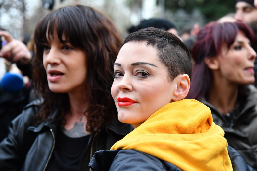 Italian actress Asia Argento (L) and US singer and actress Rose McGowan, who both accuse Harvey Weinstein of sexual assault, take part in a march organised by 'Non Una Di Meno' (Me too) movement on March 8, 2018 as part of the International Women's Day in Rome. (ALBERTO PIZZOLI/AFP/Getty Images)