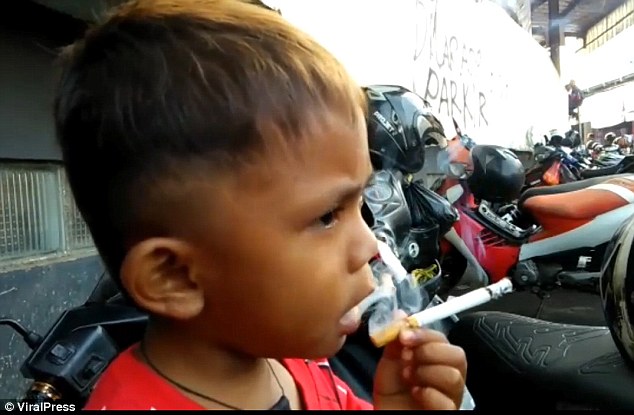 Chain smoking two year old whose mother buys him two packs a day to stop his tantrums