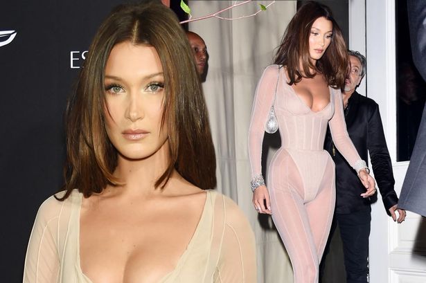 Bella Hadid rocks a VERY daring low-cut nude unitard as she joins sister Gigi and Kendall Jenner at celeb-packed Harper's Bazaar ICONS party during NYFW