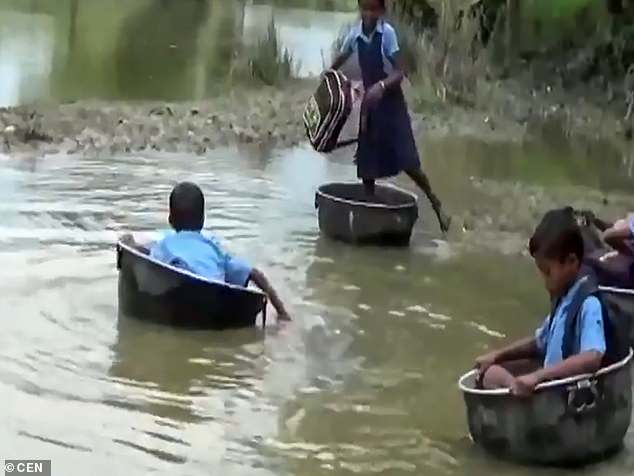 The world's most unusual school run! Indian children use pots to cross the river everyday because there are no bridges near them