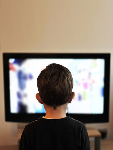 Child watching TV television film movie cartoon animation