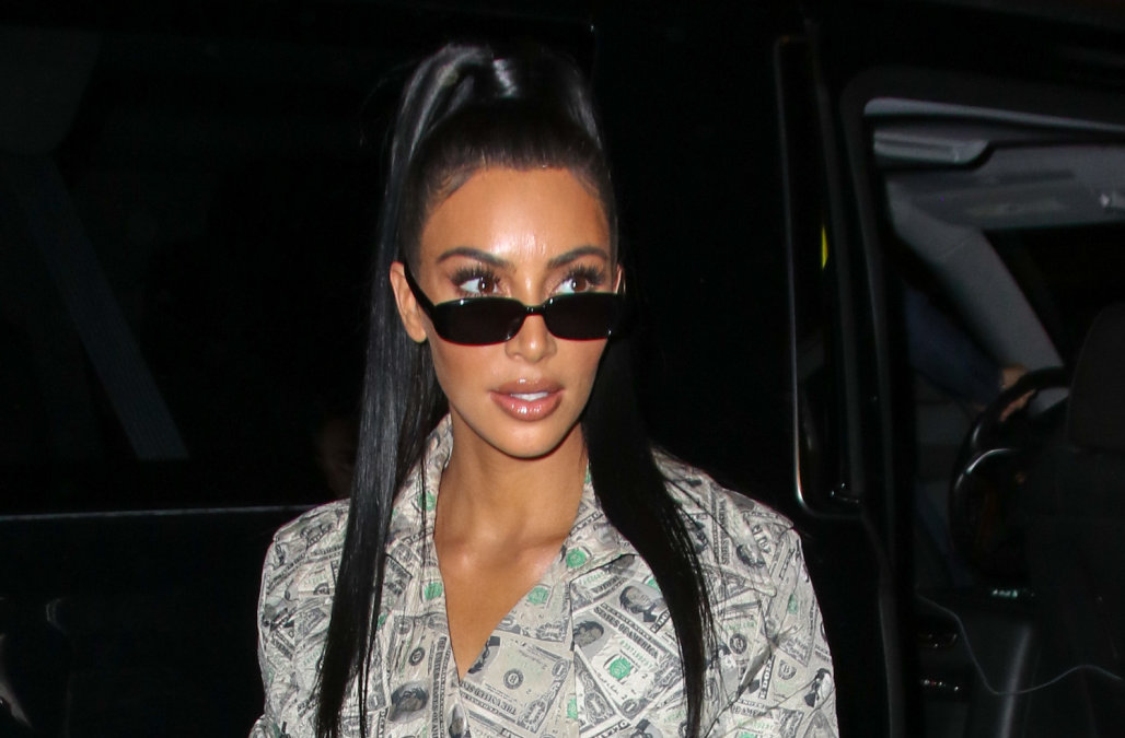 Kim Kardashian Arrives Covered In Money To Delilah Nightclub