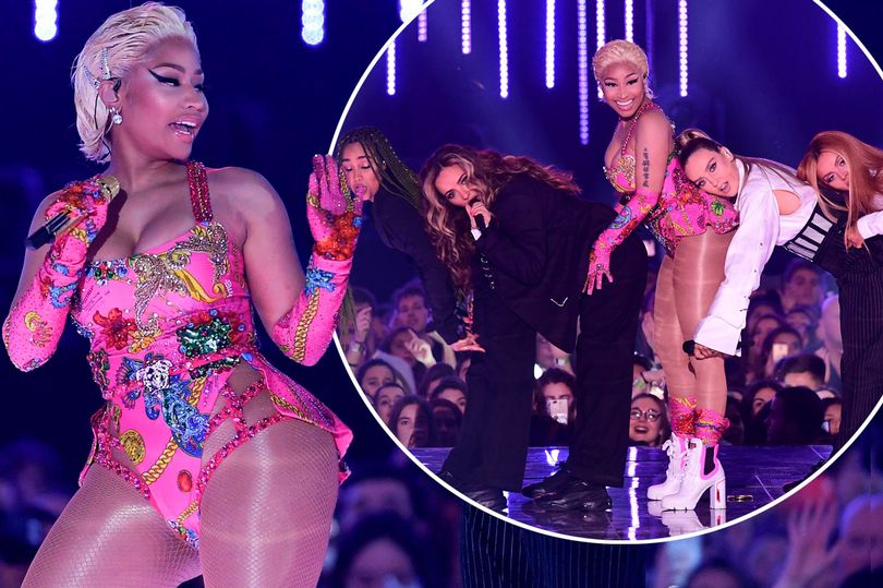 Perrie Edwards rests her head on Nicki Minaj's famous BUM during Little Mix's raunchy performance at the MTV EMAs