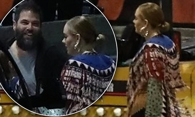 Adele enjoys rare date night with husband Simon Konecki as they arrive backstage at Elton John concert