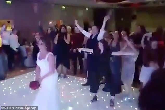 Playful brawl breaks out at wedding as guests tussle over bouquet