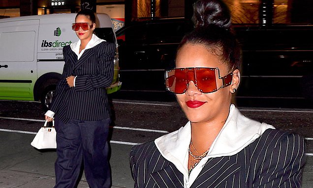 Rihanna has fun with fashion in bizarre combo of pinstripe blazer and hugely oversized trousers