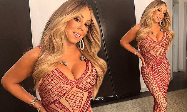Mariah Carey, 49, flaunts her very slender waistline in stunning photo