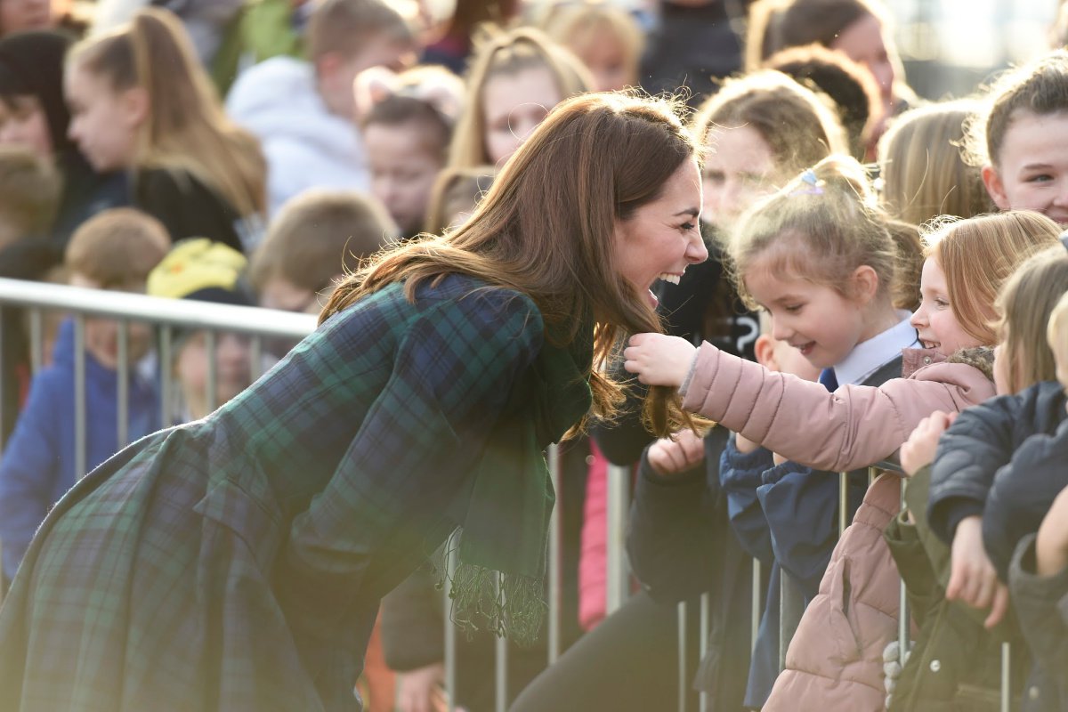 A schoolgirl touched Kate Middleton's hair and the duchess' reaction was perfect.