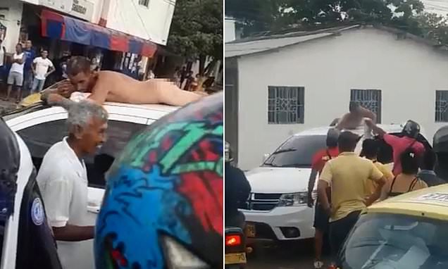 Bizarre moment cheating husband agrees to be shamed by his furious wife who parades him naked on the roof of her car after catching him in a motel room with another woman