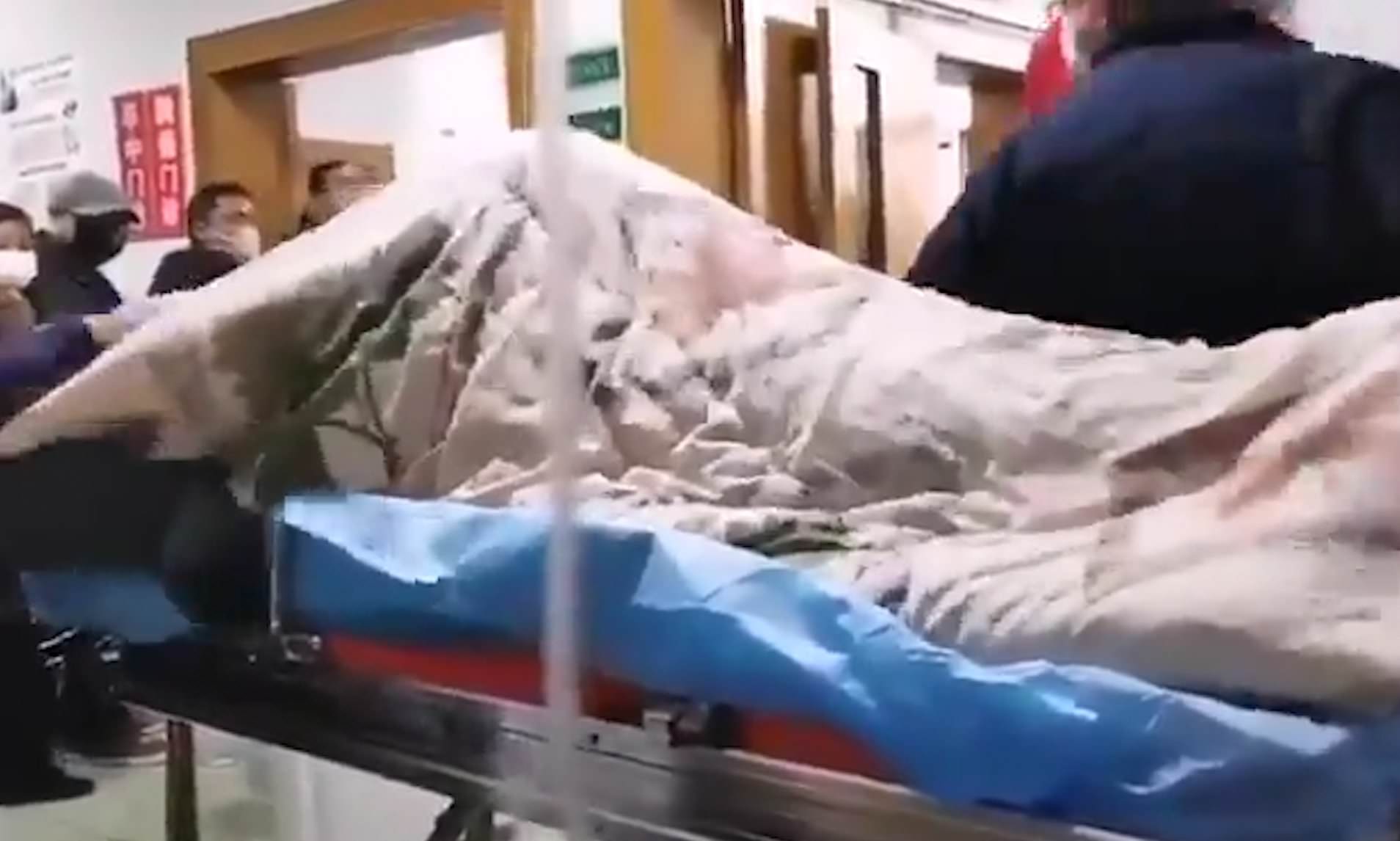 Distressing footage of 'coronavirus patient writhing on hospital trolley in infection-hit Wuhan' is shared online - as Chinese authorities continue to delete 'fake' videos of deadly outbreak