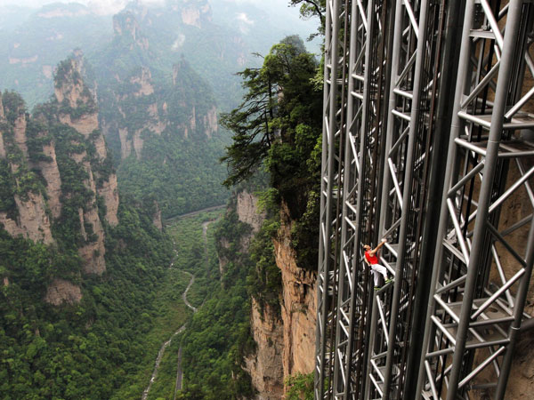 Striking aerial pictures show China's 1,070-foot-tall glass elevator built on the side of a cliff