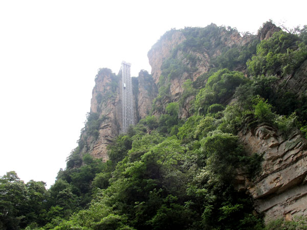 Striking aerial pictures show China's 1,070-foot-tall glass elevator built on the side of a cliff