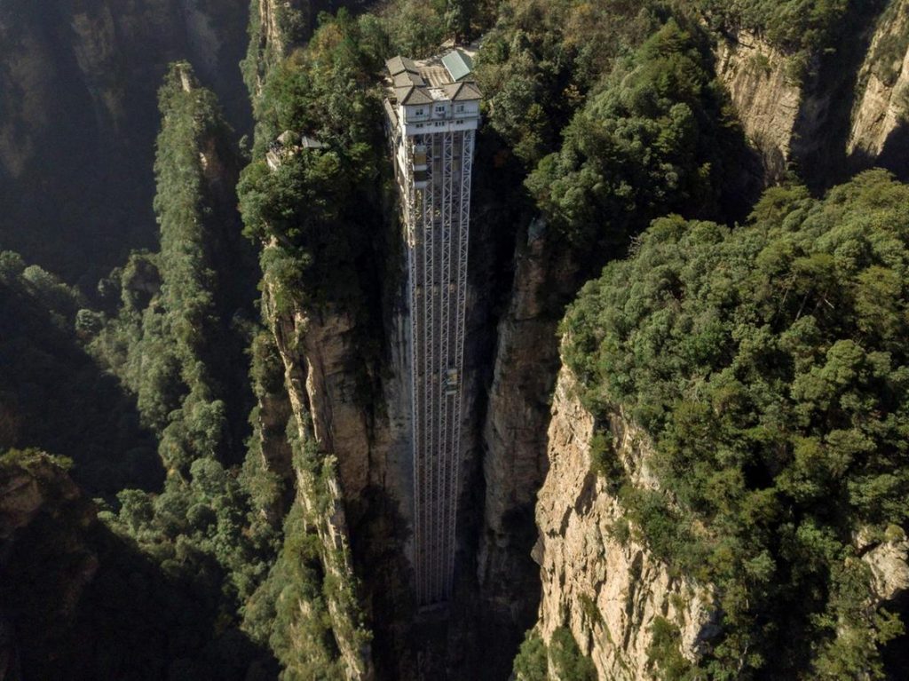 Striking aerial pictures show China's 1,070-foot-tall glass elevator built on the side of a cliff