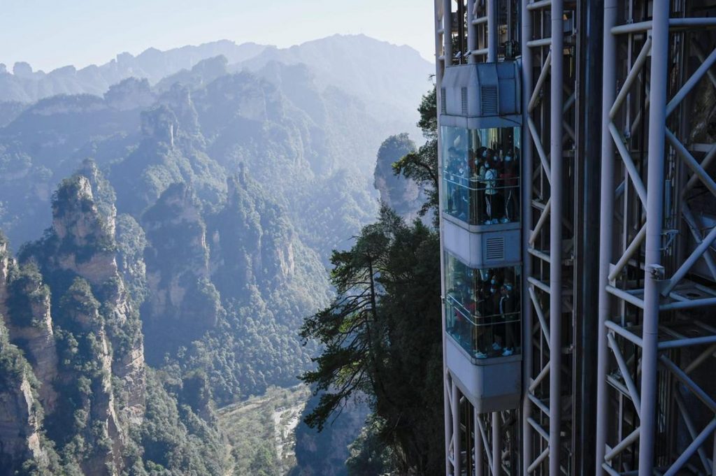 Striking aerial pictures show China's 1,070-foot-tall glass elevator built on the side of a cliff