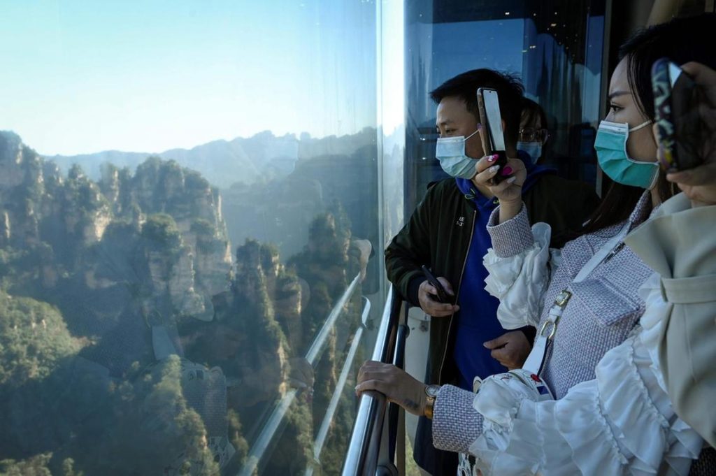 Striking aerial pictures show China's 1,070-foot-tall glass elevator built on the side of a cliff