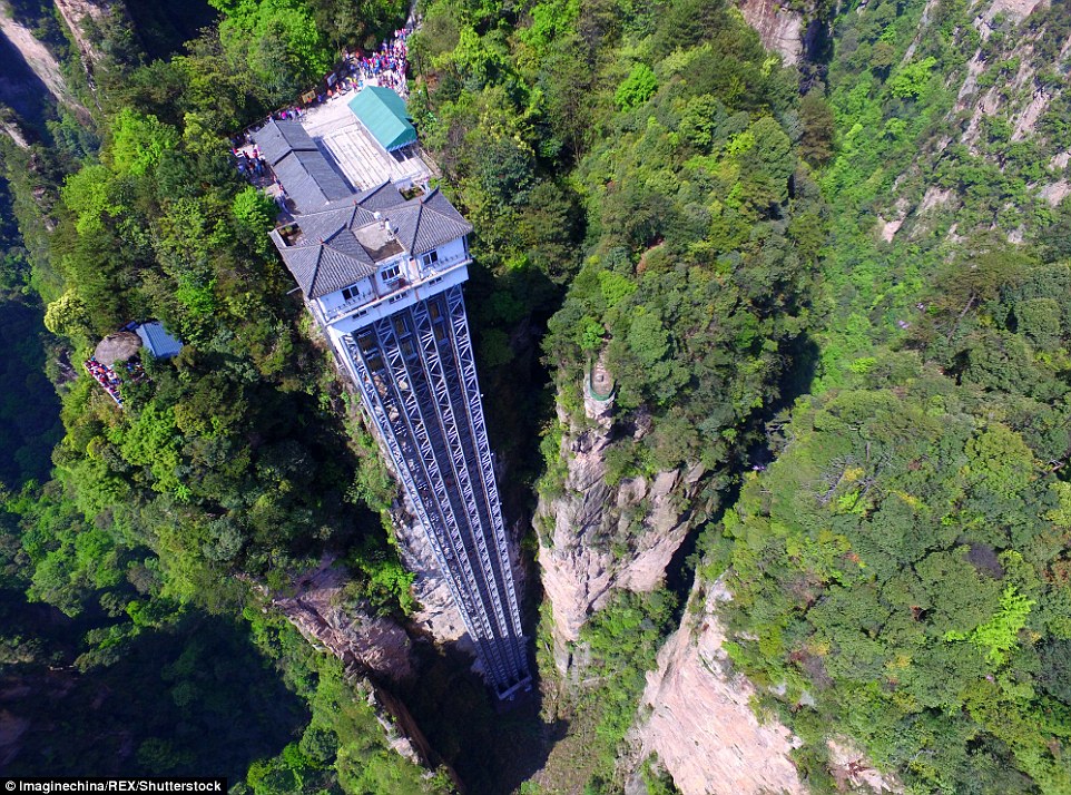 Striking aerial pictures show China's 1,070-foot-tall glass elevator built on the side of a cliff