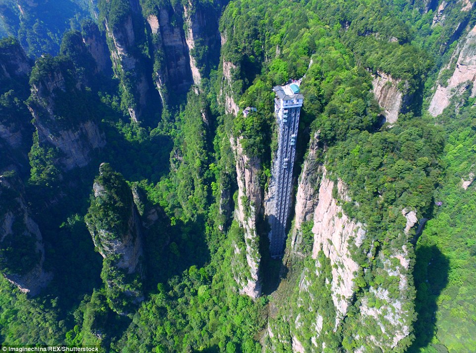 Striking aerial pictures show China's 1,070-foot-tall glass elevator built on the side of a cliff