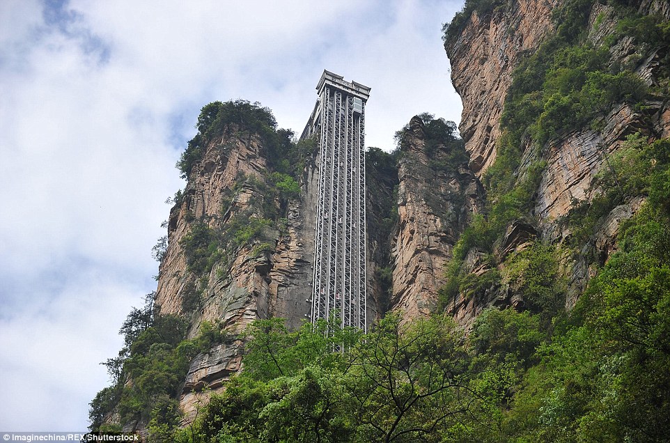 Striking aerial pictures show China's 1,070-foot-tall glass elevator built on the side of a cliff