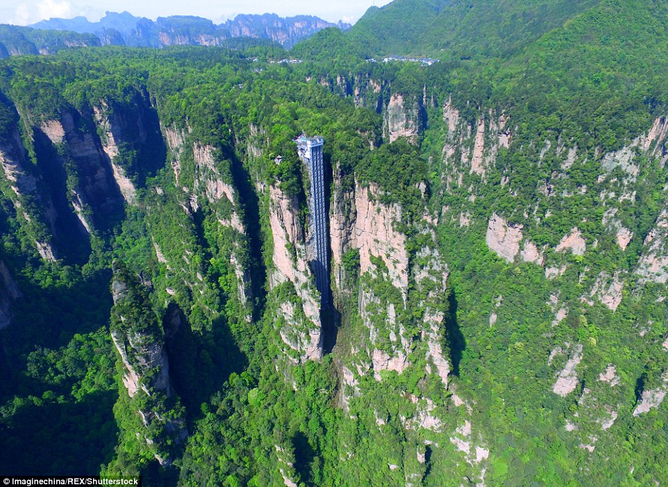 Striking aerial pictures show China's 1,070-foot-tall glass elevator built on the side of a cliff