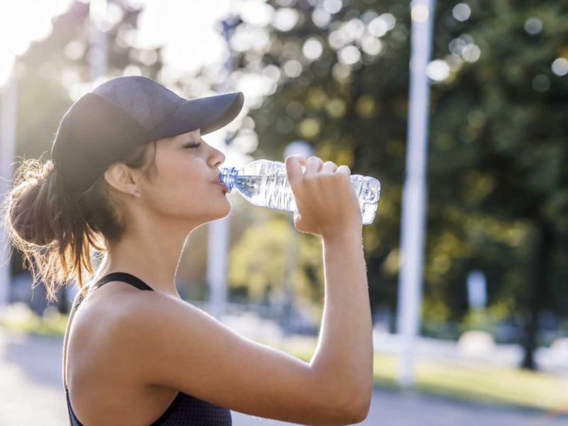woman-hydrating-with-water-during-exercise